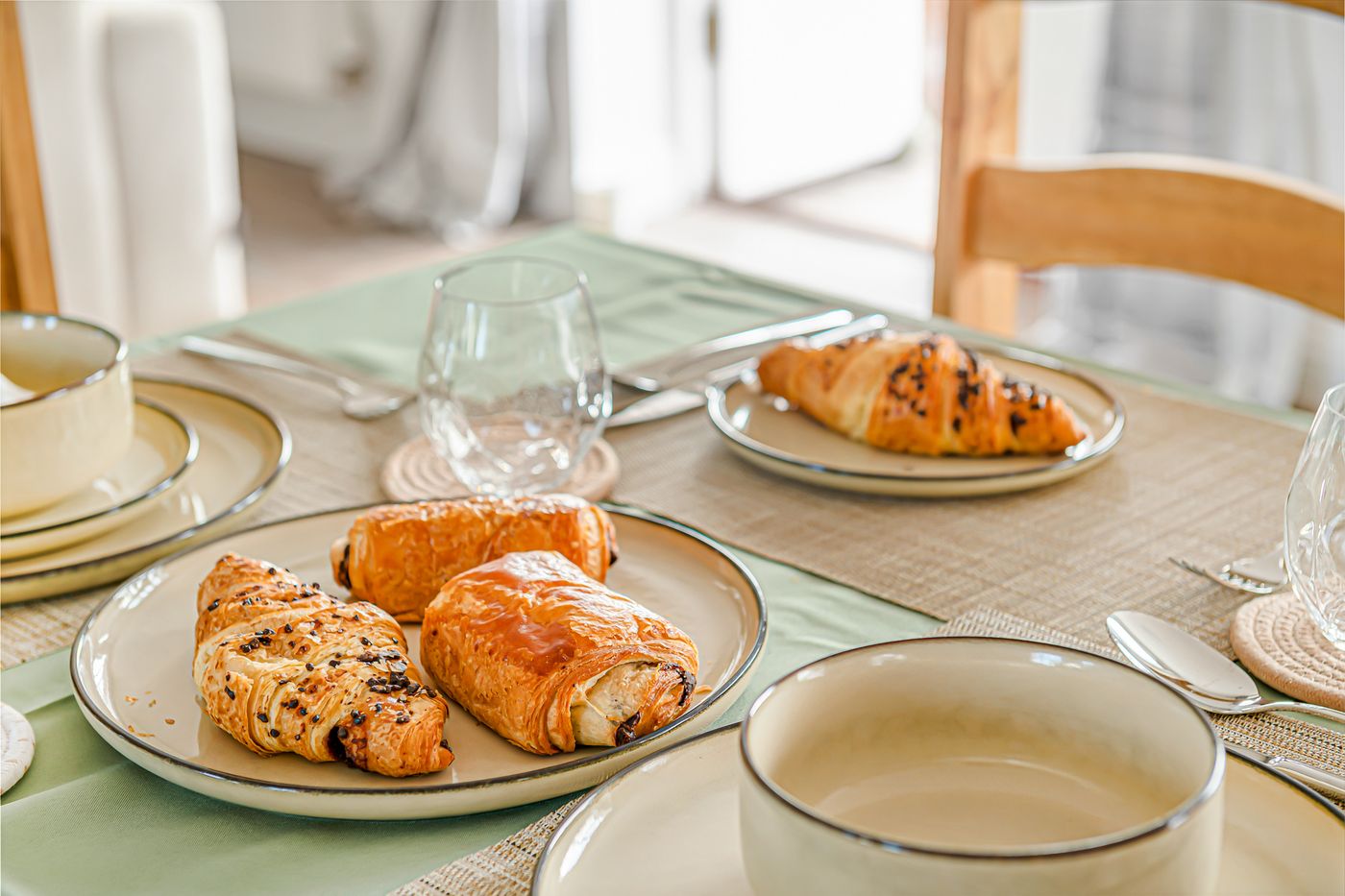 A breakfast laid out on the long oak dining table at Lower Wood Farmhouse
