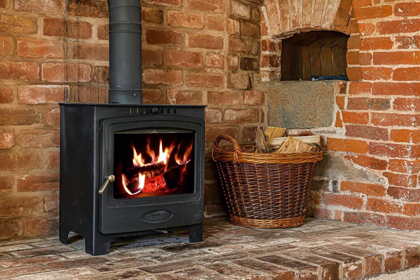 The wood-burning stove in the snug at Lower Wood Farmhouse