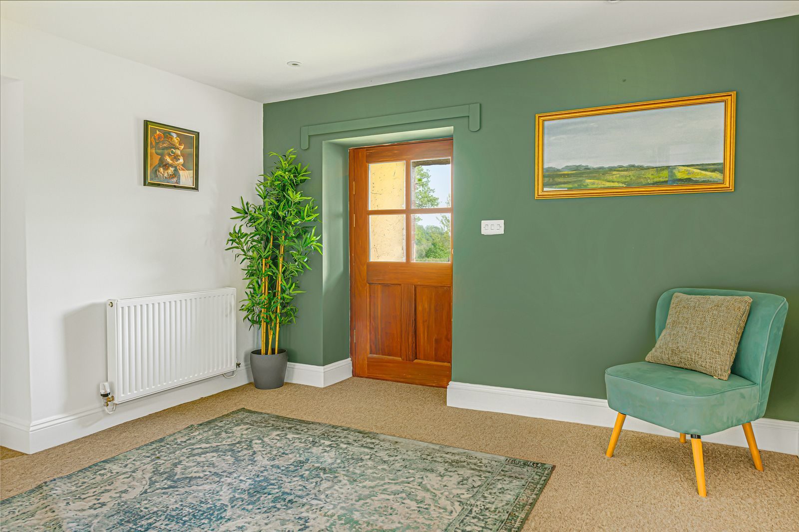 The dark green entrance hallway at Lower Wood Farmhouse, a working farmhouse near Ludlow