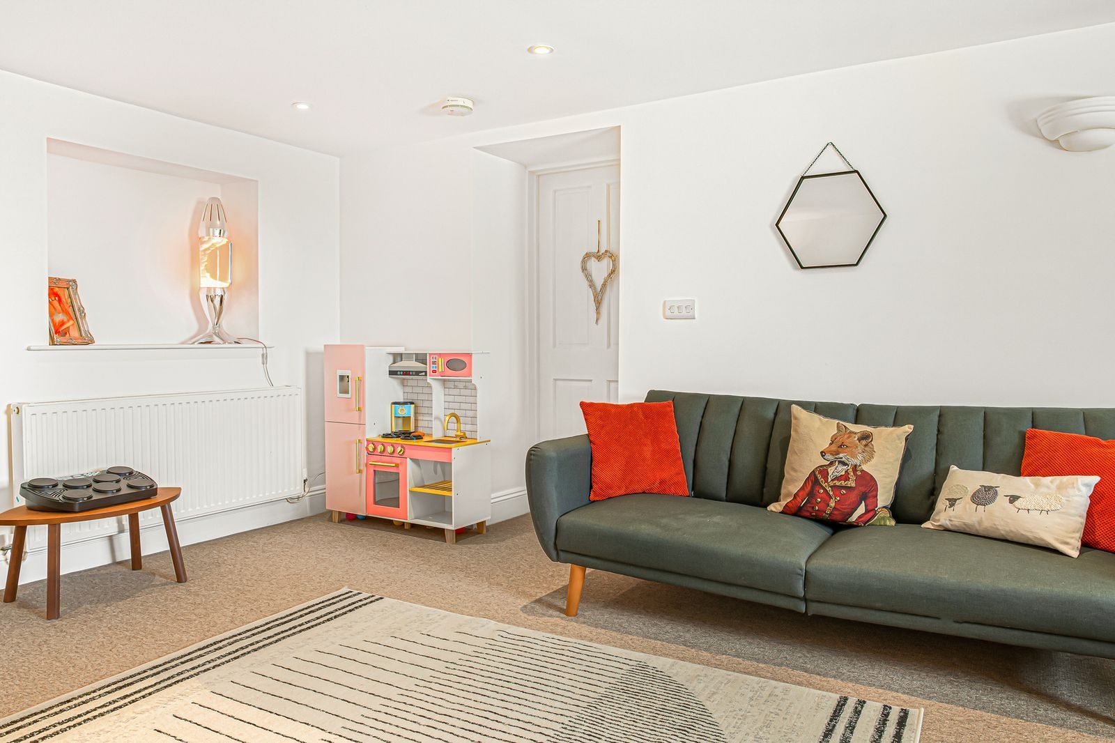 The playroom with pink toy kitchen